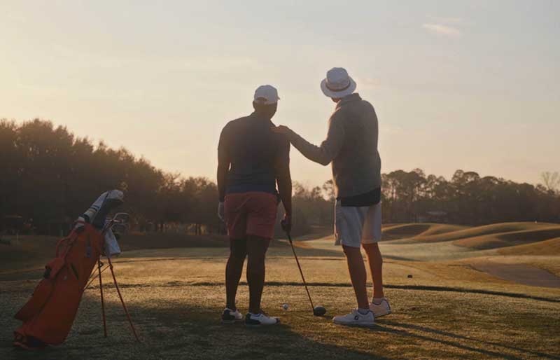two golfers talking
